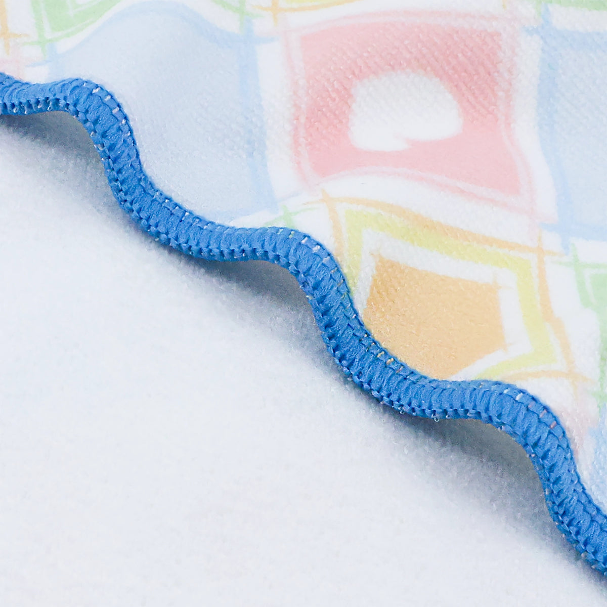 Blue patterned small towel set displayed in a bathroom