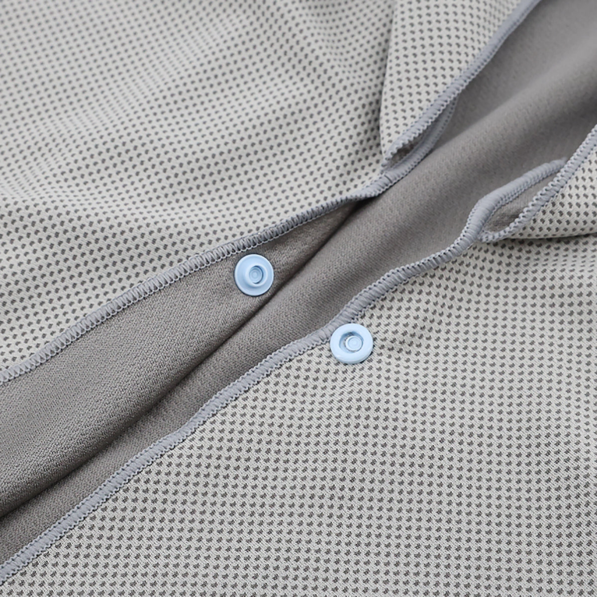 Gray cooling cape fabric and snap-button detail